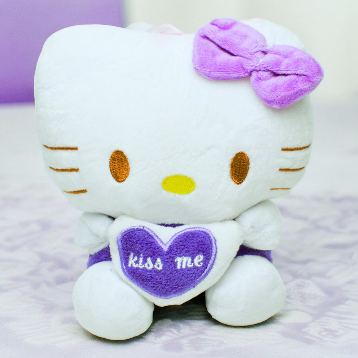 White and Purple Heard Stuff Toy Bear